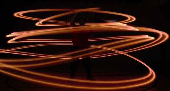 man standing within circles of light